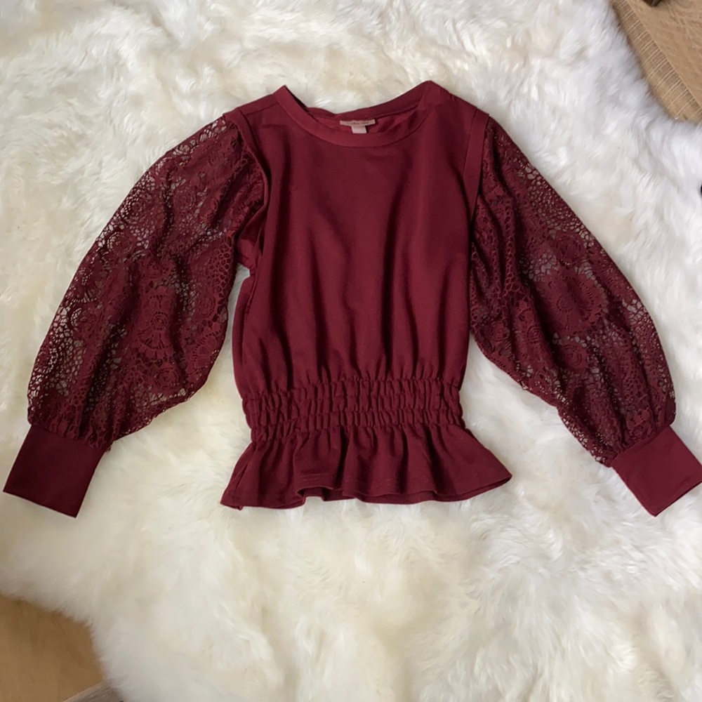 Cute burgundy peplum style top. Excellent used condition.